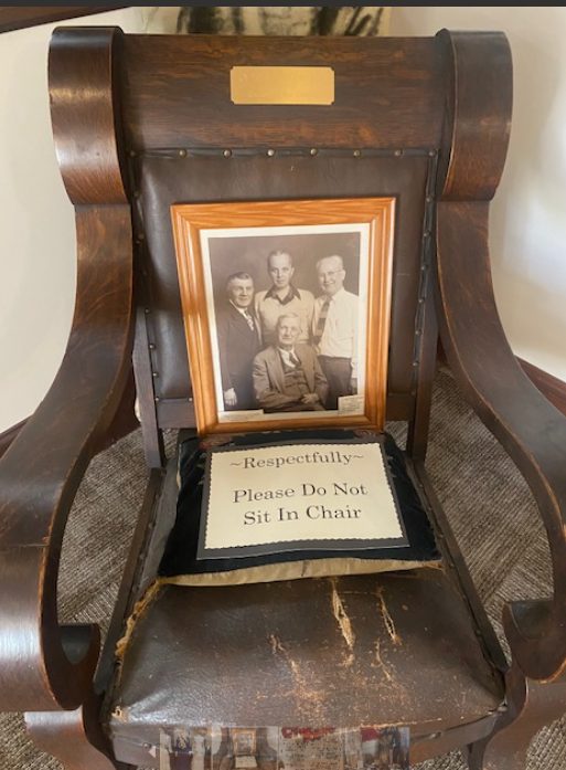 Cy Young's antique rocking chair with a please-do-not-sit sign