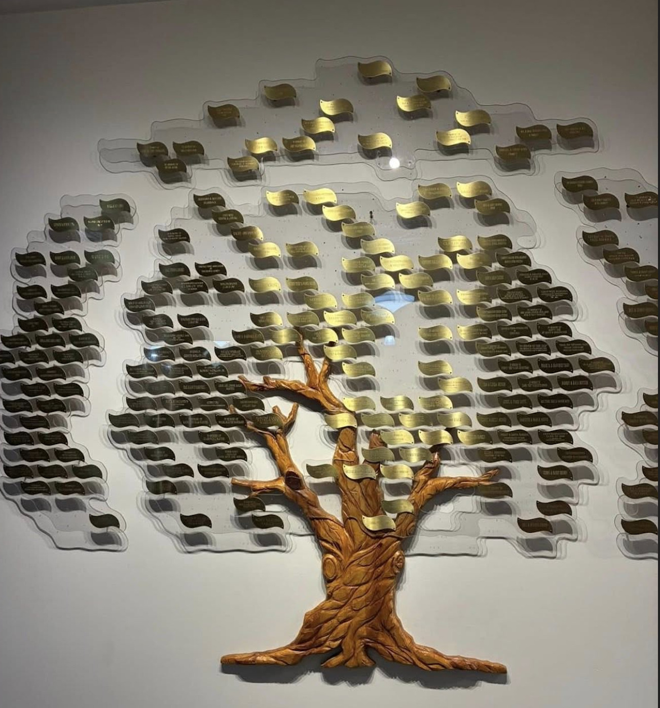The hand-carved Memorial Tree with engraved brass leaves