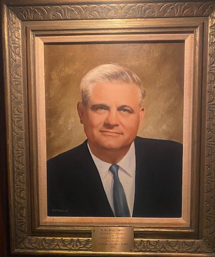 Oil portrait of Woody Hayes in a suit